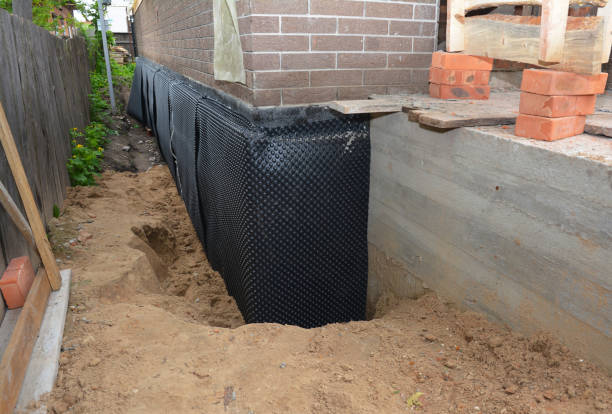 SJ Waterproofing Pros technician performing targeted Exterior Waterproofing assessment in Tenafly, NJ